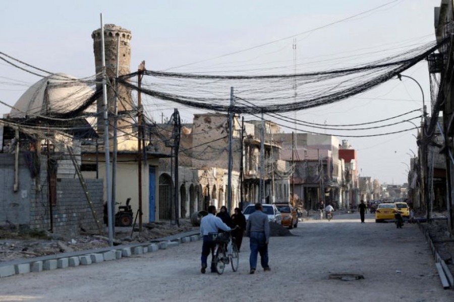 People walk on the street, where Islamic State leader Abu Bakr al-Baghdadi declared his caliphate back in 2014, in the old city of Mosul, Iraq, October 27, 2019. Reuters/Files