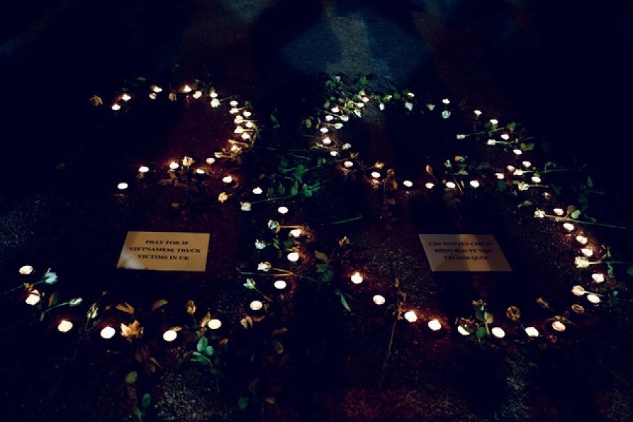 Candles are lit during a prayer for 39 people found dead in the back of a truck near London, in front of Hanoi Cathedral in Hanoi, Vietnam Oct 27, 2019. REUTERS