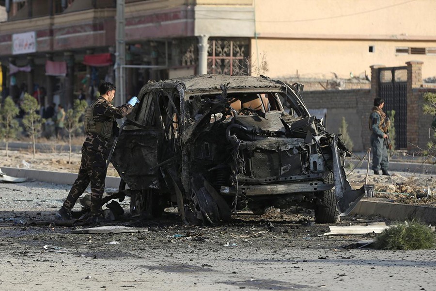 A member of the Afghan security forces inspects the site of a suicide blast in Kabul, Afghanistan on November 13, 2019 — Reuters photo