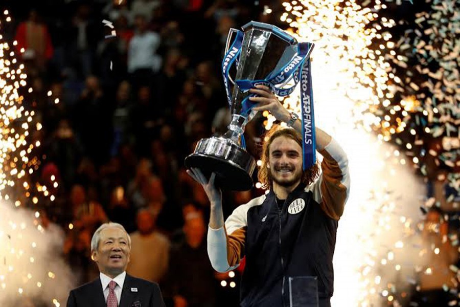 Greece's Stefanos Tsitsipas celebrates winning the ATP Finals with the trophy — Reuters photo