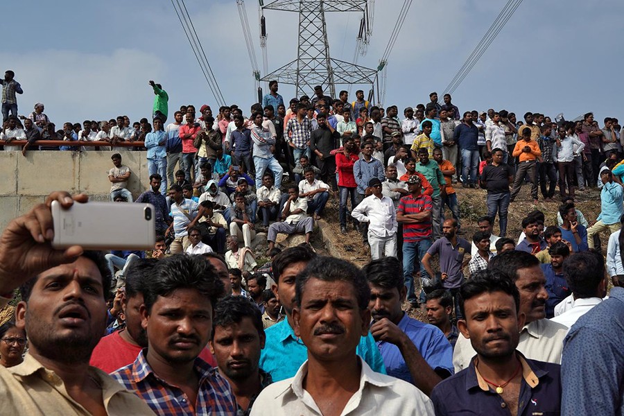 People gather at the site where police shot dead four men suspected of raping and killing a 27-year-old veterinarian, in Chatanpally on the outskirts of Shadnagar town, Telangana, India on December 6, 2019 — Reuters photo