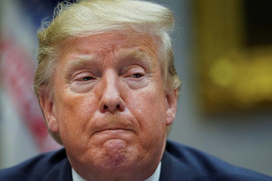 President Donald Trump listens while participating in a "roundtable on small business and red tape reduction accomplishments" in the Roosevelt Room at the White House in Washington, US, December 6, 2019. Reuters