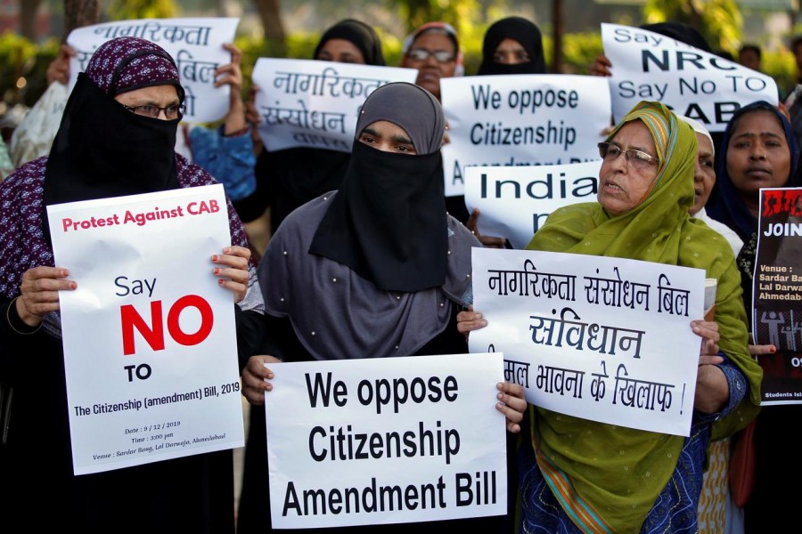 Demonstrators display placards during a protest against the Citizenship Amendment Bill, a bill that seeks to give citizenship to religious minorities persecuted in neighbouring Muslim countries, in Ahmedabad, India, December 9, 2019. Reuters