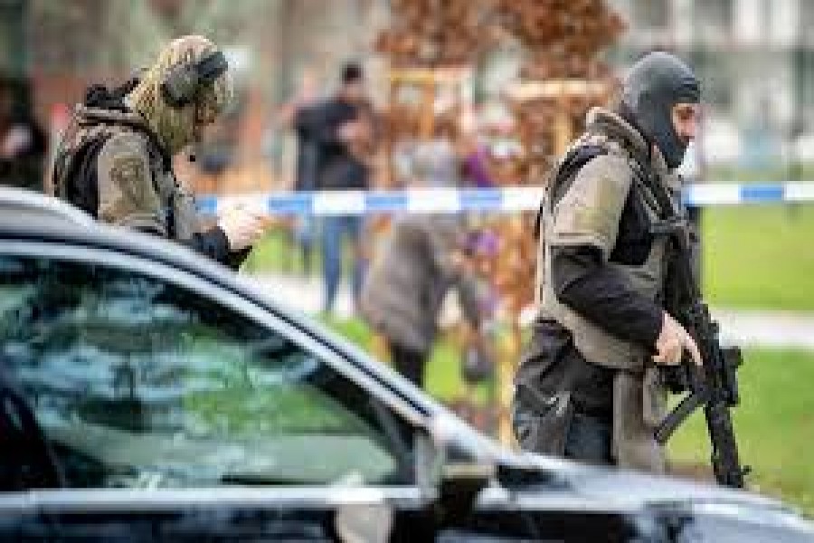 Police officers are seen near the site of a shooting in front of a hospital in Ostrava, Czech Republic, December 10, 2019. REUTERS/Lukas Kabon