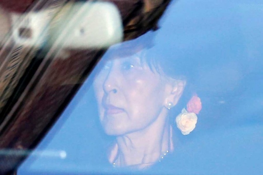 Myanmar's leader Aung San Suu Kyi arrives at the International Court of Justice (ICJ), ahead of hearings in a case filed by Gambia against Myanmar alleging genocide against the minority Muslim Rohingya population, in The Hague, Netherlands December 10, 2019. Reuters