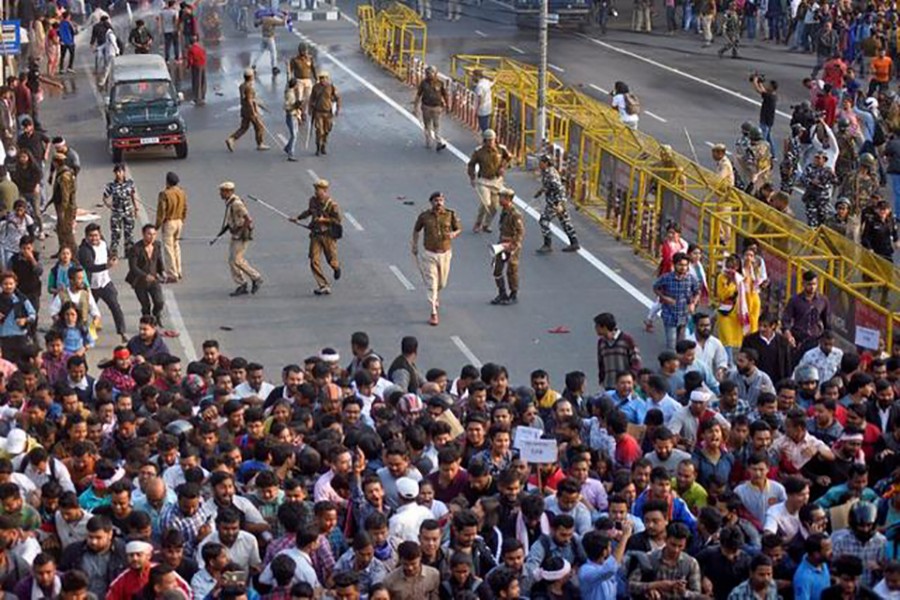 Police chase away demonstrators during a protest against Citizenship Amendment Bill (CAB), that seeks to give citizenship to religious minorities persecuted in neighbouring Muslim countries, in Guwahati, India on December 11, 2019 — Reuters photo