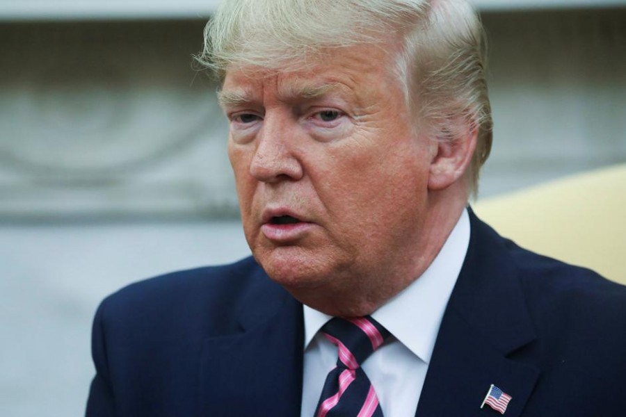 US President Donald Trump talks to reporters as he meets with Paraguay's President Mario Abdo Benitez in the Oval Office at the White House in Washington, US, December 13, 2019. Reuters