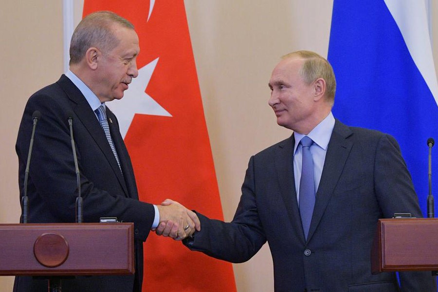 Turkish President Tayyip Erdogan shaking hands with Russian President Vladimir Putin during a news conference following their talks in Russia in October. -Reuters file photo