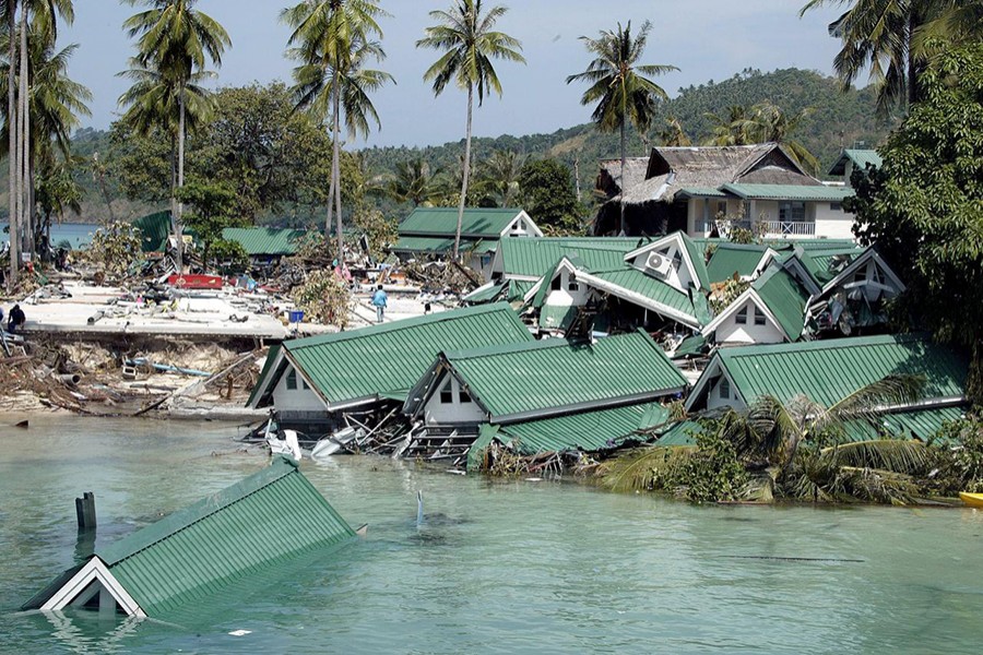 Submerged buildings are seen near the pier at Ton Sai Bay in Thailand's Phi Phi island on December 28, 2004 after a tsunami hit the area — Reuters/Files