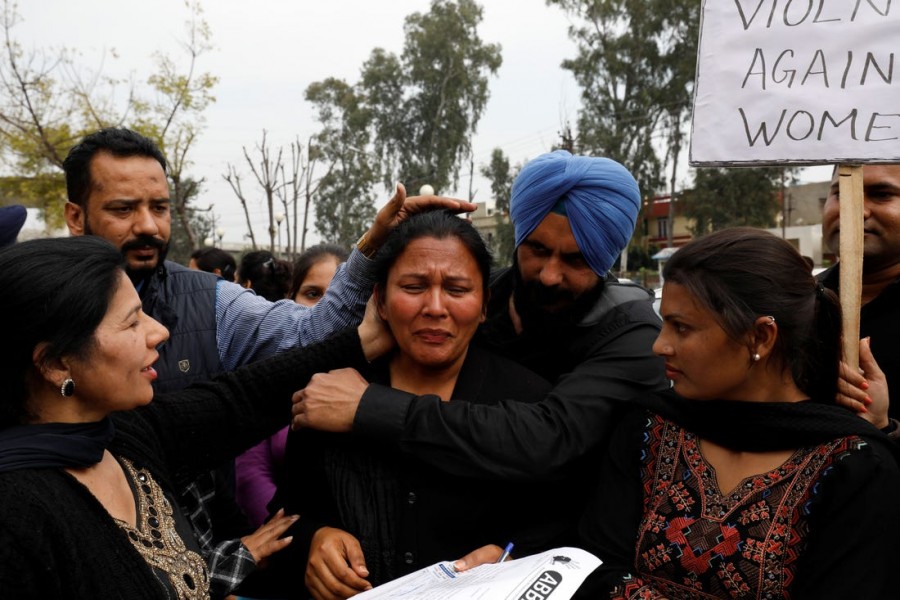 Women, who say they have been abandoned by their NRI (non-resident Indian) husbands, take part in an organised protest outside the regional passport office in Jalandhar, Punjab, India, March 8, 2019. Reuters/Files