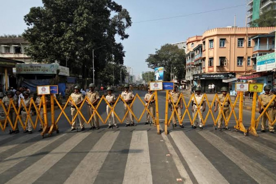 Police stand guard during a protest rally against a new citizenship law, in Mumbai, India, December 26, 2019. Reuters