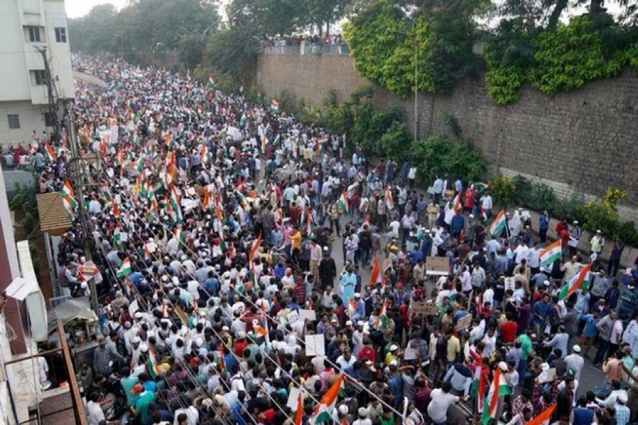 Demonstrators hold placards and flags as they attend a protest rally against a new citizenship law, in Hyderabad, India, January 04, 2020. Reuters