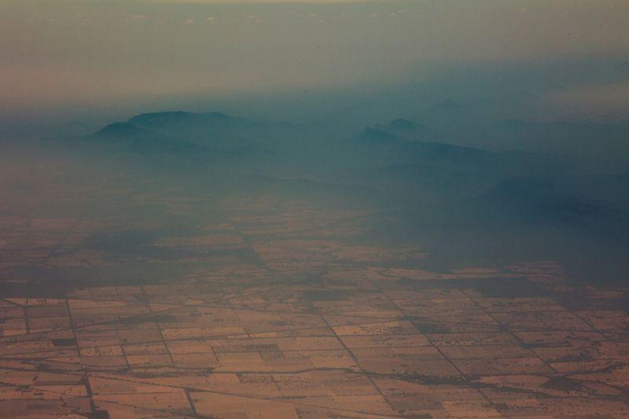 Smoke and haze over mountains are seen from a No 11 Squadron P-8A Poseidon conducting damage assessment and surveillance in the bushfire-affected area near Cooma, New South Wales, Australia on January 7, 2020 — Australian Department of Defence/Handout via REUTERS