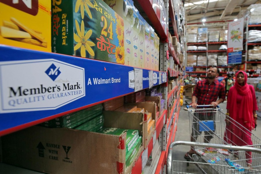 FILE PHOTO: Customers shop at a Walmart India's Best Price Modern Wholesale store in Jammu May 8, 2018. REUTERS/Mukesh Gupta/File Photo