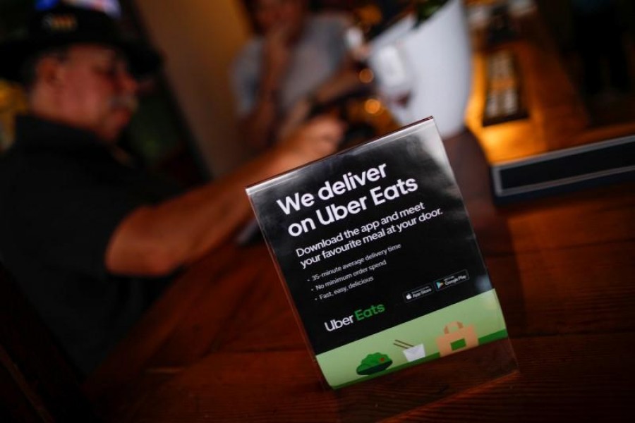 A flyer advertising Uber Eats delivery service is pictured at a restaurant in Cape Town, South Africa, January 2, 2020. REUTERS/Mike Hutchings/Files