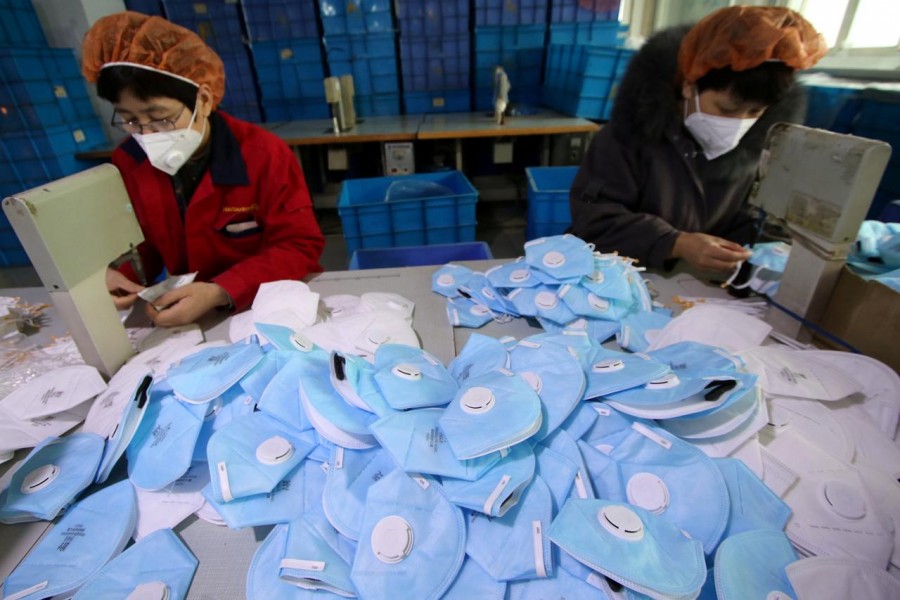 Workers make protective masks at a factory in Handan, Hebei province, China on January 22, 2020 — China Daily via REUTERS