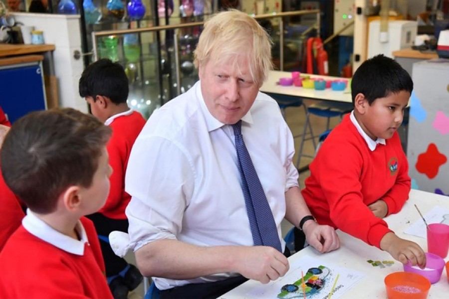 Britain's prime minister Boris Johnson participates in a workshop with children from the Richard Avenue Primary School prior to chairing a cabinet meeting at the National Glass Centre at the University of Sunderland, Sunderland, Britain, January 31, 2020. Reuters