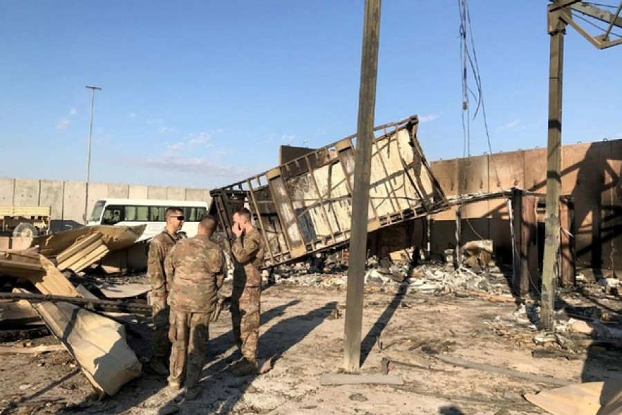 US soldiers are seen at the site where an Iranian missile hit at Ain al-Asad air base in Anbar province, Iraq Jan 13, 2020. REUTERS/John Davison