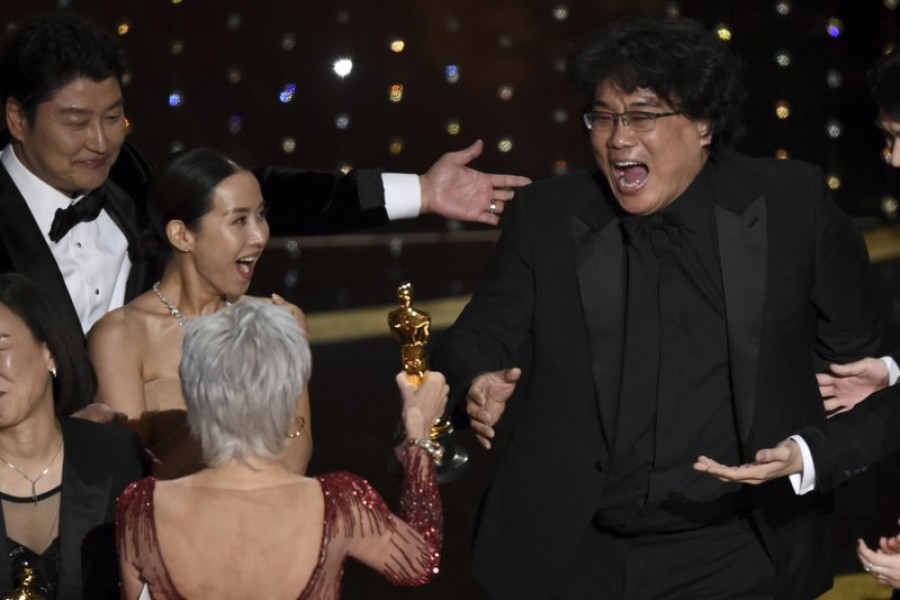 Bong Joon Ho, right, reacts as he is presented with the award for best picture for "Parasite" from presenter Jane Fonda at the Oscars on Sunday, Feb. 9, 2020, at the Dolby Theatre in Los Angeles. Looking on from left are Kang-Ho Song and Kwak Sin Ae.(AP Photo/Chris Pizzello)