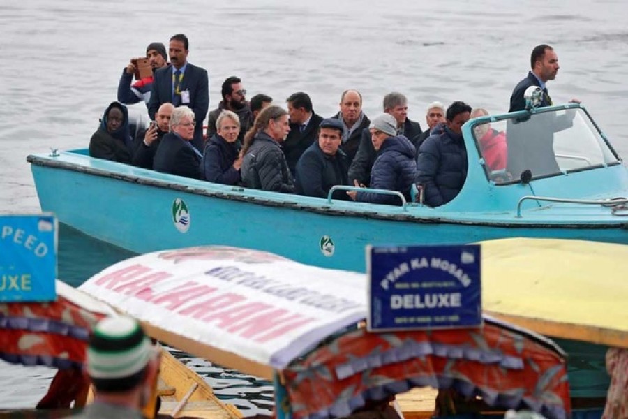 Foreign diplomats are seen in a motorboat in Dal Lake in Srinagar, February 12, 2020. Reuters