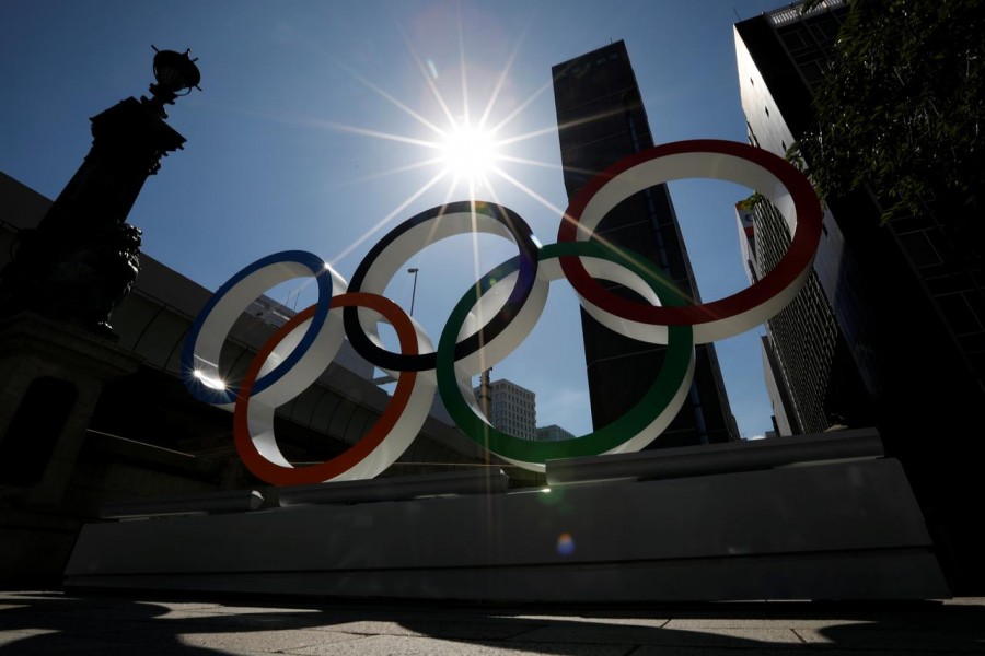 FILE PHOTO: Summer sunshine is seen through Olympic rings displayed at Nihonbashi district in Tokyo, Japan August 5, 2019. REUTERS/Issei Kato