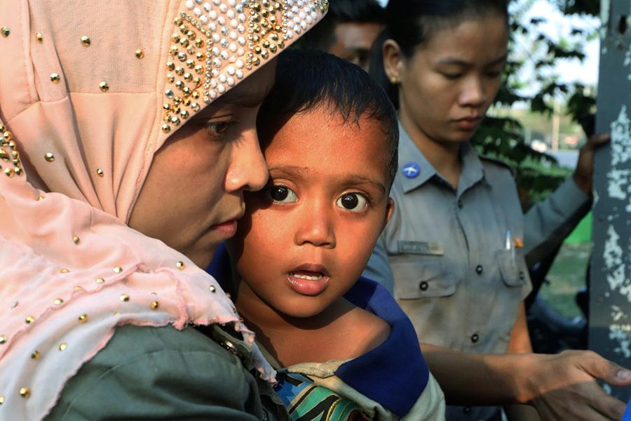 Arrested Rohingya people leaving a court outside Yangon in Myanmar on Friday. -Reuters Photo