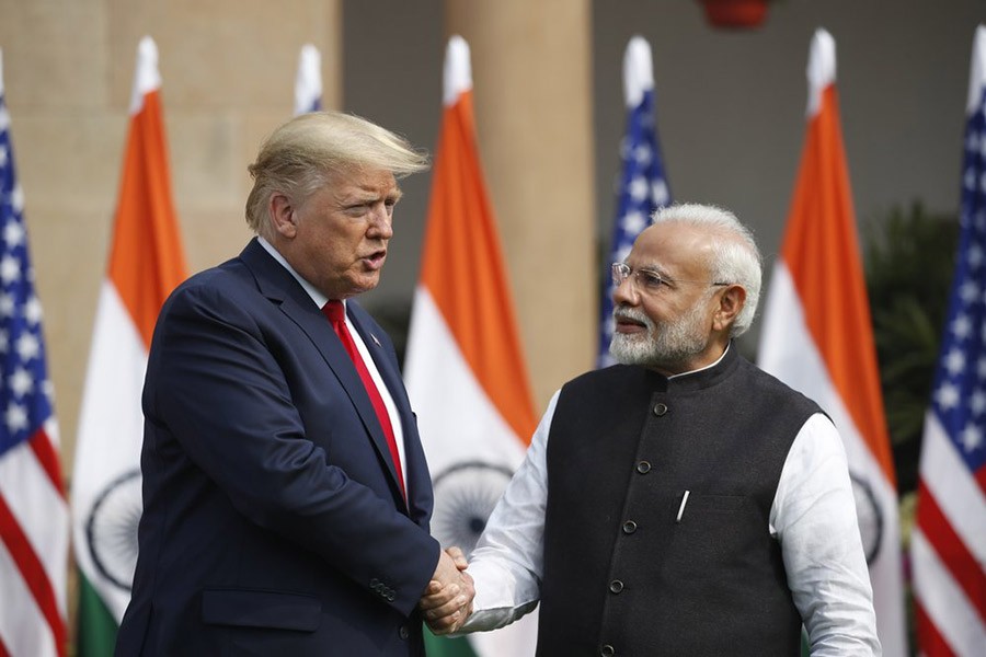 US President Donald Trump and Indian Prime Minister Narendra Modi shaking hands before their meeting at Hyderabad House in New Delhi, India, on Tuesday. -AP Photo