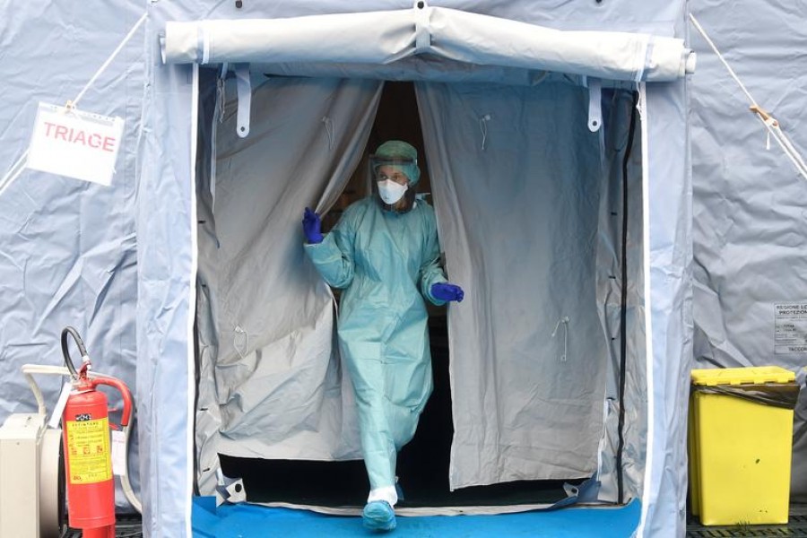 A medical worker wearing protective mask is seen at a medical checkpoint at the entrance of the Spedali Civili hospital in Brescia, Italy on March 3, 2020 — Reuters photo