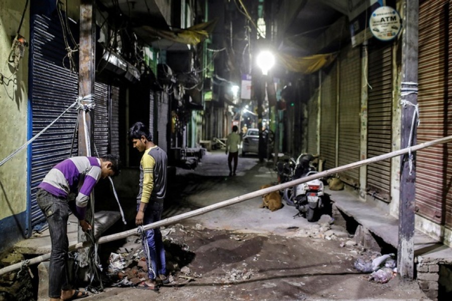 Muslims erect a barricade in a lane following Hindu-Muslim clashes triggered by a new citizenship law, in Kardam Puri in the riot-affected northeast of New Delhi, India, March 04, 2020. — Reuters