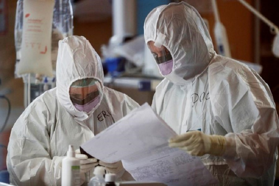 Medical workers in protective suits treat a patient suffering with coronavirus disease (COVID-19) in an intensive care unit at the Casalpalocco hospital, a hospital in Rome that has been dedicated to treating cases of the disease, Italy, March 24, 2020. — Reuters