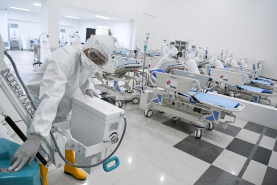 A medical officer checks devices at an emergency hospital, handling coronavirus disease (COVID-19) at Kemayoran Athletes Village, in Jakarta, Indonesia March 23, 2020. Antara Foto/Hafidz Mubarak A via REUTERS