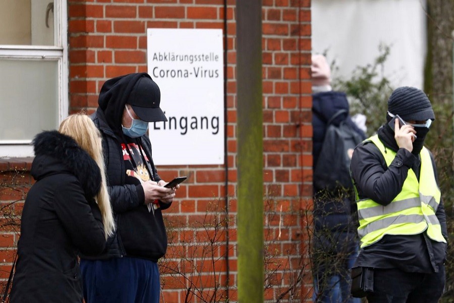 People wait outside a newly opened coronavirus disease (COVID-19) clearing up center in Berlin, Germany, March 9, 2020. — Reuters