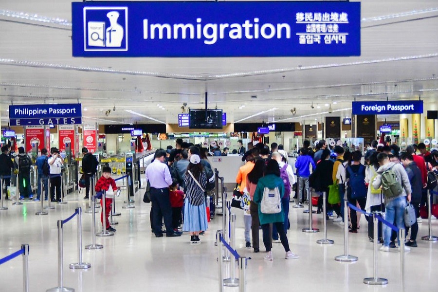 China bars foreign visitors as imported cases rise