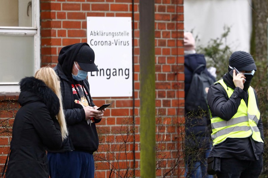 People wait outside a newly opened coronavirus disease (COVID-19) clearing up center in Berlin, Germany on March 9, 2020 — Reuters photo