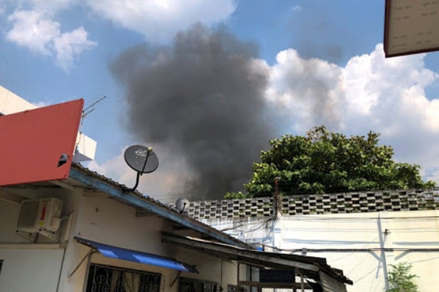 Smoke rises from Buriram prison during a riot that was sparked by rumours of a coronavirus outbreak in Buriram province, Thailand, Mar 29, 2020. REUTERS