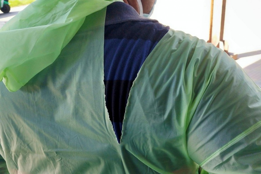 A doctor wearing a torn raincoat stands at the major coronavirus disease (COVID-19) treatment facility amid concerns about the spread of the disease in Kolkata, India, March 26, 2020. REUTERS/Stringer