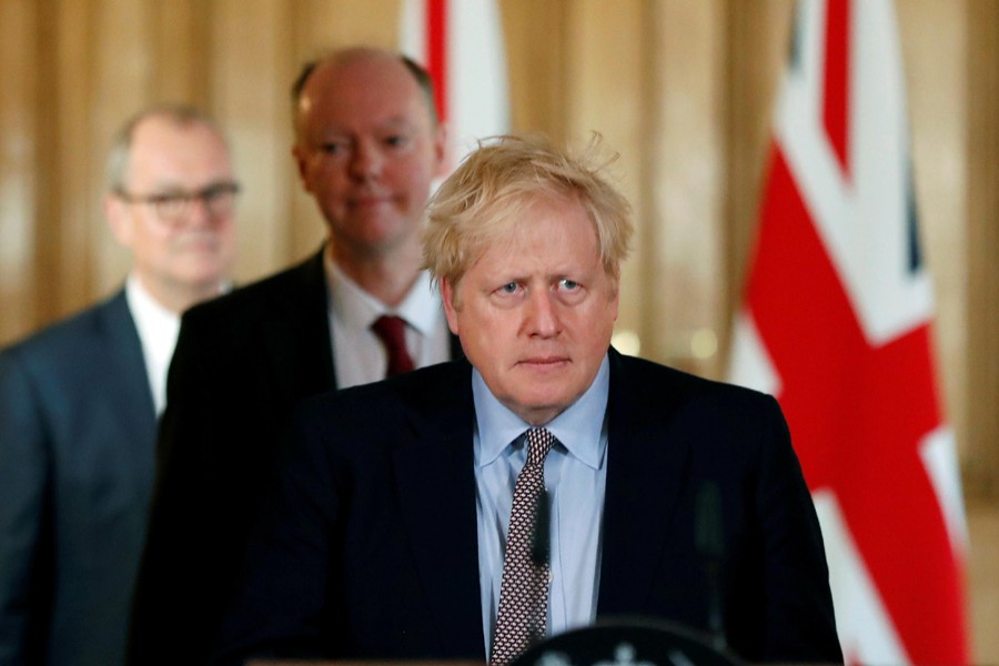 Britain's Prime Minister Boris Johnson, Chris Whitty, Chief Medical Officer for England and Chief Scientific Adviser to the Government, Sir Patrick Vallance, arrive for a news conference on the novel coronavirus, in London, Britain on March 3, 2020 — Reuters/Files