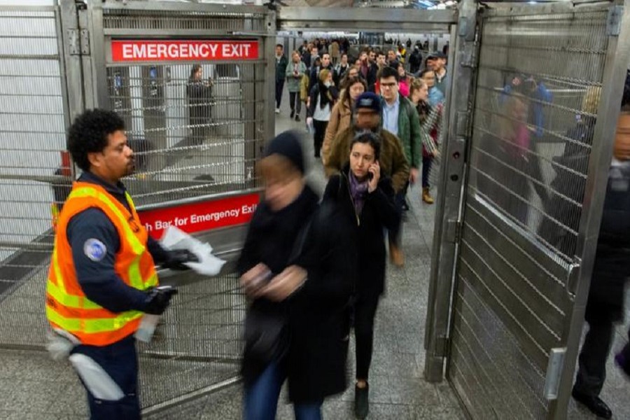 MTA workers disinfect the subway station while people exit the station in the Manhattan borough of New York City, New York, US, March 04, 2020. — Reuters/Files