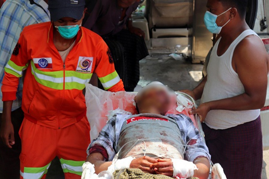 A man who, according to the villagers, was wounded in a shelling arrives at Sittwe General Hospital in Rakhine State, Myanmar  on April 13, 2020 — via Reuters