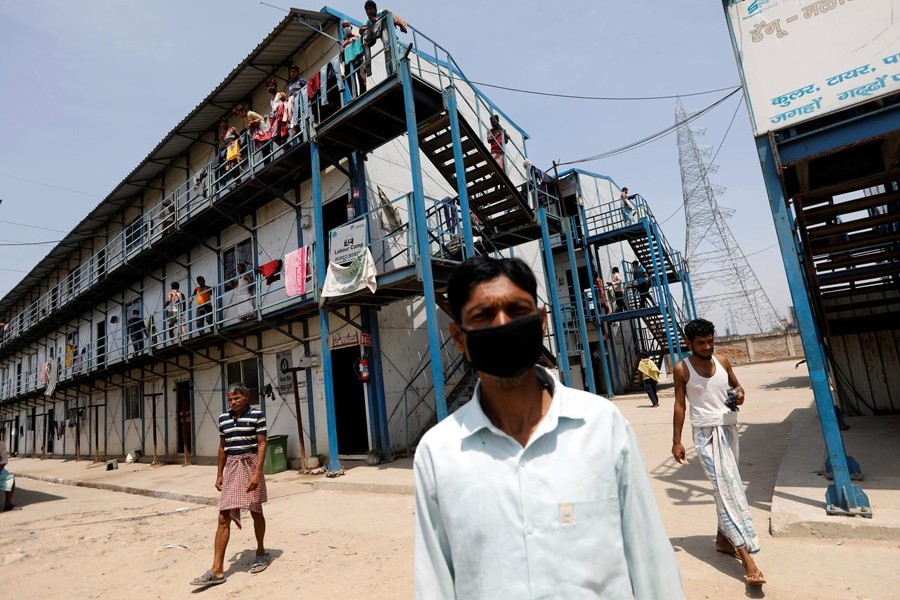 Daily wage labourers stand outside their quarters at a construction site where activity has been halted due to 21-day nationwide lockdown to slow the spreading of the coronavirus disease (COVID-19), in New Delhi, India on April 10, 2020 — Reuters photo