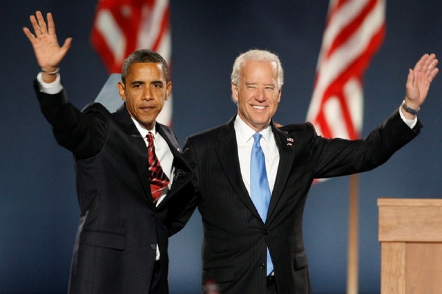 FILE PHOTO: US President-elect Senator Barack Obama and Vice President-elect Senator Joe Biden wave to supporters after speaking at Obama's election night rally after being declared the winner of the 2008 U.S. Presidential election in Chicago, US November 4, 2008. Reuters