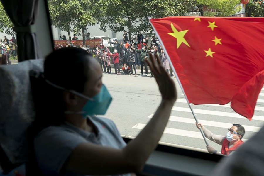    Citizens bid farewell to medics from the Peking Union Medical College Hospital in Wuhan, capital of central China's Hubei Province, April 15, 2020. The last medical assistance team started leaving Hubei Province Wednesday as the COVID-19 epidemic in the hard-hit province has been subdued. The medical team consisting of over 180 medical workers from the Peking Union Medical College Hospital arrived in the provincial capital of Wuhan on Jan. 26. (Xinhua/Xiong Qi)