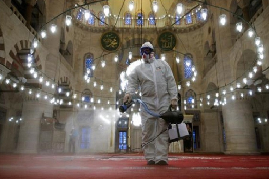 A municipality worker in a protective suit disinfects Kilic Ali Pasha Mosque due to coronavirus concerns in Istanbul, Turkey last month. — Reuters file photo