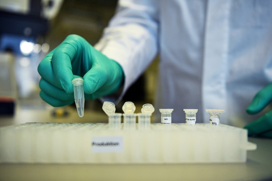 Employee Philipp Hoffmann, of German biopharmaceutical company CureVac, demonstrates research workflow on a vaccine for the coronavirus (COVID-19) disease at a laboratory in Tuebingen, Germany on March 12, 2020 — Reuters/Files