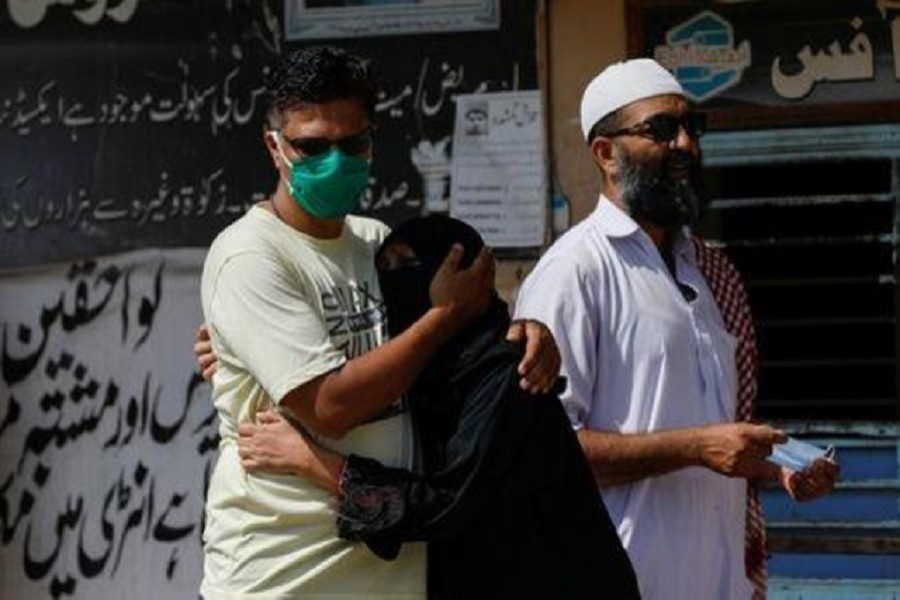 Family members mourn the death of a relative who was killed in a plane crash, outside a morgue in Karachi, Pakistan, May 23, 2020. — Reuters