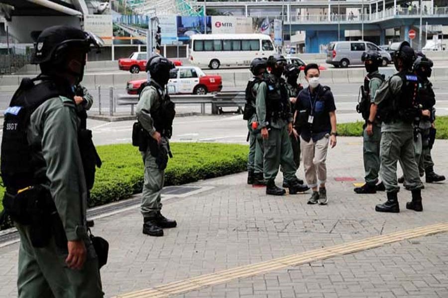 Riot police officers stand guard outside the Central Government Complex as a second reading of a controversial national anthem law takes place in Hong Kong on May 27. REUTERS   