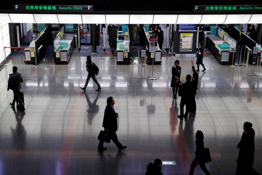 Passengers are seen in front of security check at the Tokyo International Airport, commonly known as Haneda Airport, in Tokyo, Japan on January 10, 2018 — Reuters/Files