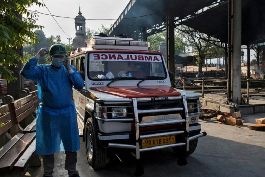 Mohammad Aamir Khan, an ambulance driver, waits for relatives to unload the bodies of people who died of the coronavirus disease for their cremation at a crematorium in New Delhi, India, June 11, 2020. — Reuters