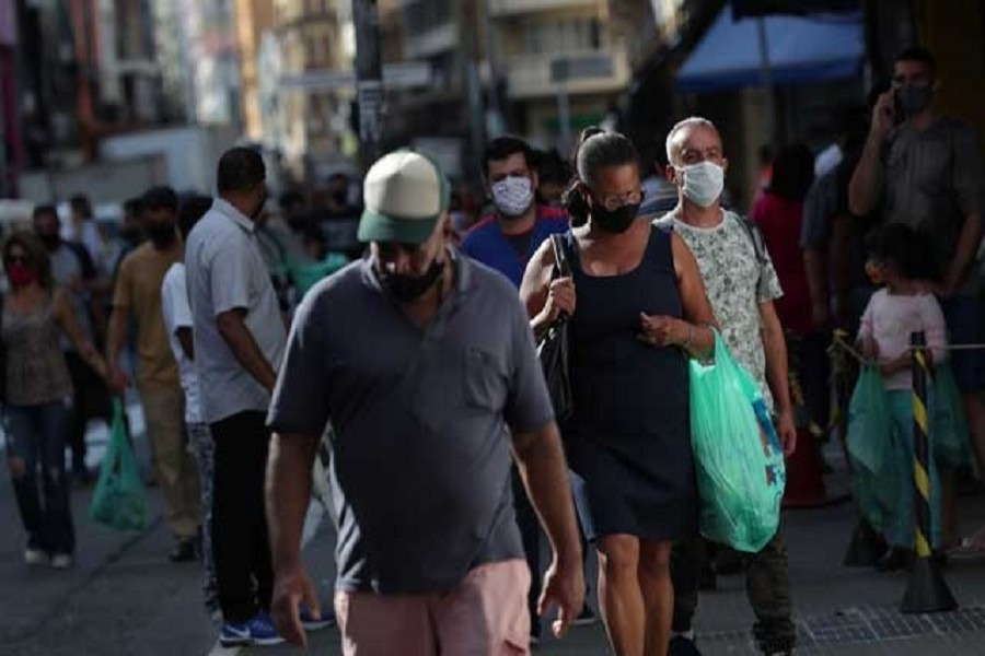 A woman carries a bag after shopping as the city hall eases restrictions and allows commerce to open amid the coronavirus disease (COVID-19) outbreak, in Sao Paulo, Brazil, June 11, 2020. — Reuters/Files