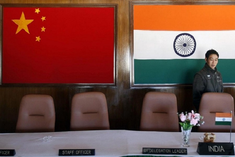 A man walks inside a conference room used for meetings between military commanders of China and India, at the Indian side of the Indo-China border at Bumla, in the northeastern Indian state of Arunachal Pradesh, November 11, 2009 — Reuters/Files